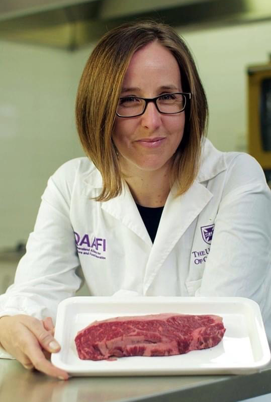 UQ QAAFI Dr Heather Smyth holding Westholme Wagyu in the sensory test kitchen.