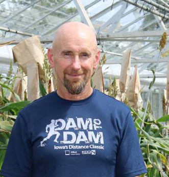 Headshot of Professor Mark Cooper in a greenhouse