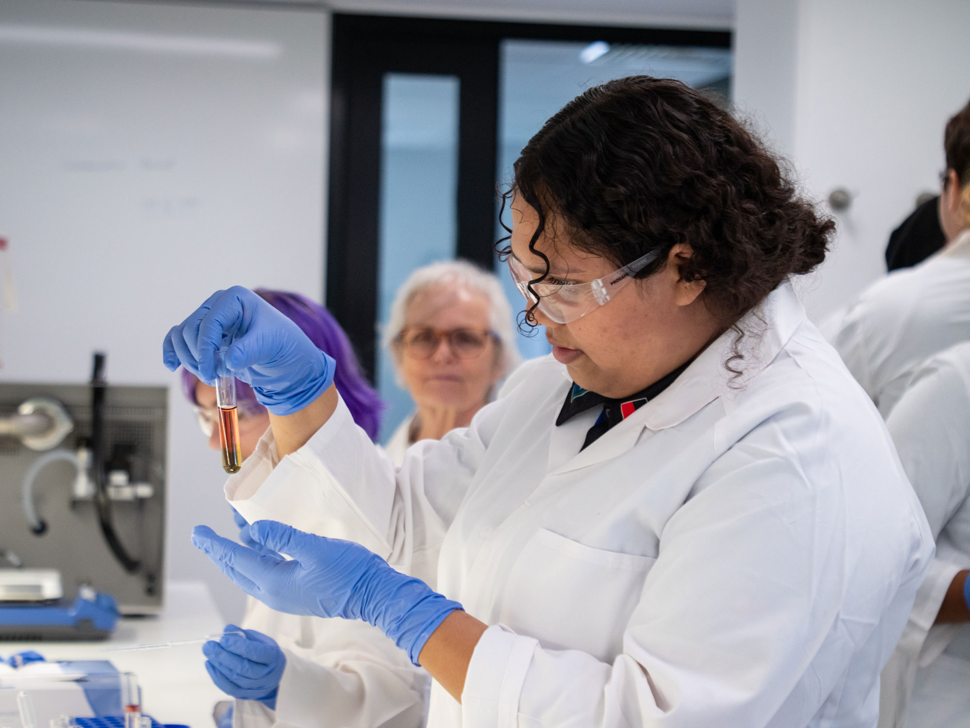 researcher in lab with test tube