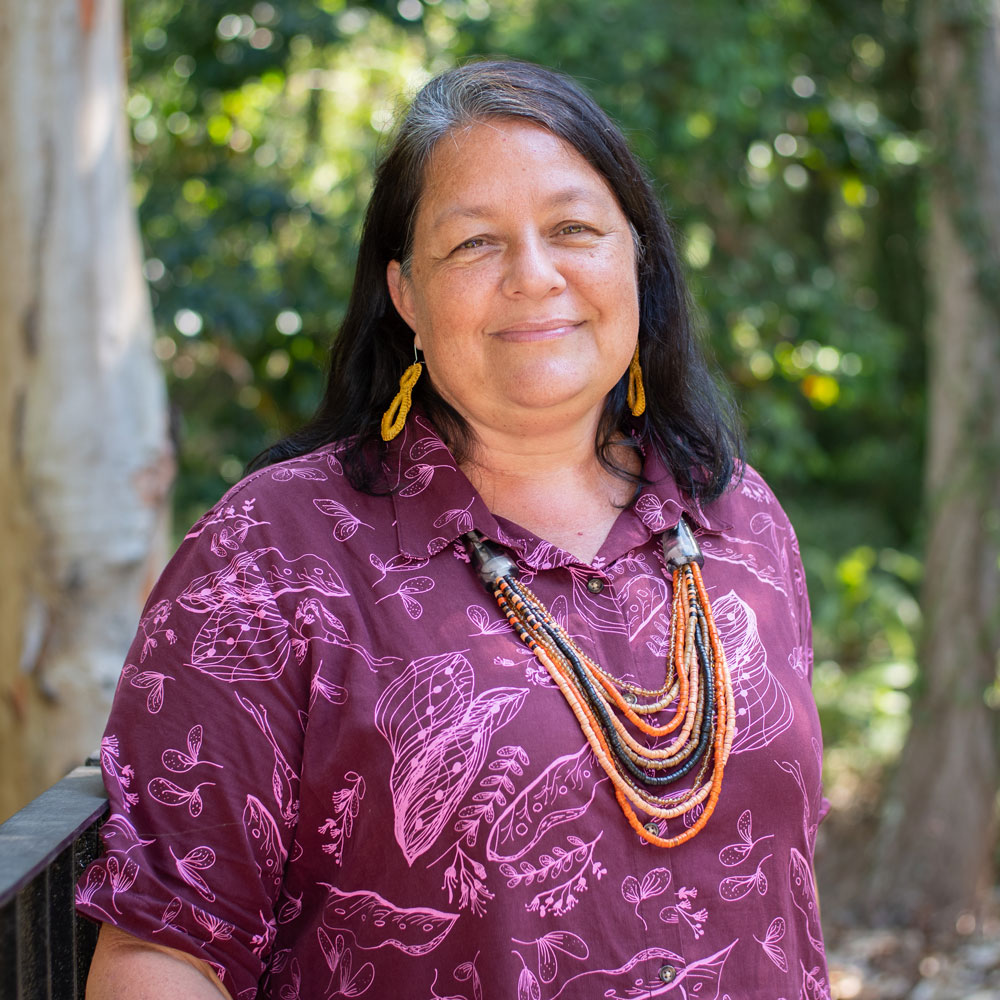 Headshot of Sherie Bruce in green bush setting 