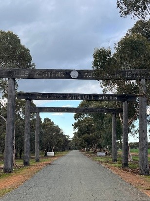 sot of posts on a driveway to a property 